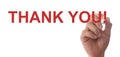 Hand writing Thank You with red marker Royalty Free Stock Photo