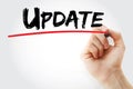Hand writing Update with red marker, business concept Royalty Free Stock Photo