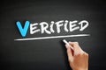Hand writing Verified on blackboard, concept background Royalty Free Stock Photo