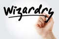 Hand writing Wizardry with marker Royalty Free Stock Photo