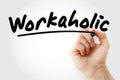 Hand writing Workaholic with marker Royalty Free Stock Photo