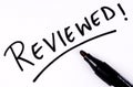 Hand written Reviewed word Royalty Free Stock Photo