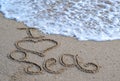 Hand written typography lettering I love Sea on the sand Royalty Free Stock Photo