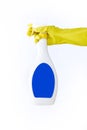 Hand in yellow glove holds spray bottle of liquid detergent on white background. cleaning Royalty Free Stock Photo