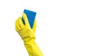 Hand in a yellow rubber glove with a cleaning sponge isolated on a white background Royalty Free Stock Photo