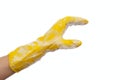 Hand in a yellow rubber glove