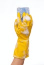 Hand in yellow rubber glove Royalty Free Stock Photo