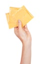 Hand with yellow square cheddar cheese isolated on white background