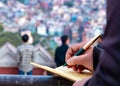 Hand of a young businessman taking notes with a fountain pen on a notecopy.  Student learning online. Blogger. selective focus Royalty Free Stock Photo