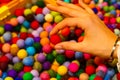 Hand of young girl with red wool ball Royalty Free Stock Photo