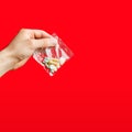 Hand of a young man holding a pills Royalty Free Stock Photo