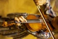 Hand of a young violinist holding the neck and pressing the strings playing violins, flat-lay, horizontal