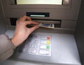 Hand of young woman while getting money from atm Royalty Free Stock Photo