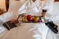 The hand of Young woman that hold wine glass And Sit play laptop In a luxurious room Ready Fruit Royalty Free Stock Photo