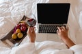 The hand of Young woman that hold wine glass And Sit play laptop In a luxurious room Ready Fruit Royalty Free Stock Photo