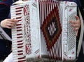 Hand of a young woman plays the ancient accordion Royalty Free Stock Photo
