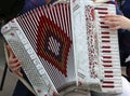 Hand of a young woman plays the ancient accordion Royalty Free Stock Photo