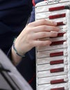 Hand of a young woman plays the ancient accordion Royalty Free Stock Photo