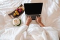 The hand of Young woman Sit play laptop In a luxurious room Ready Fruit Royalty Free Stock Photo