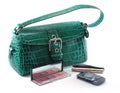 Handbag with cell phone and makeup Royalty Free Stock Photo