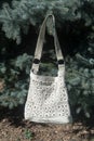 Nice handbag in sunny outdoor in the garden