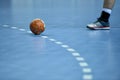 Handball ball laying on the 9 meters dotted line Royalty Free Stock Photo