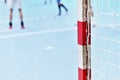 Handball goalpost with players in background