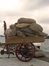 Handcart full of bags in Amsterdam harbor