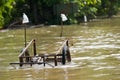 Handcart left at a flooded road