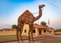 handcraft iron made camel with bright blue sky at evening