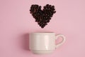 Blend of coffee beans and symbol of love for the background concept. Royalty Free Stock Photo