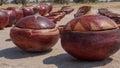 Handcrafted brown clay pots used for storage of dry produce. Location: Namibia