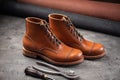 Handcrafted brown leather shoe with cobbler tools