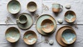 Of handcrafted ceramic tableware displayed on a light fabric Royalty Free Stock Photo