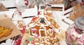 Handcrafted Christmas gingerbread house on red velvet