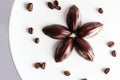 Handcrafted dark chocolate, on white background with coffee beans. Top view of single origin coffee mixed with chocolate Royalty Free Stock Photo