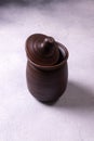 Handcrafted dark clay pot with lid object Royalty Free Stock Photo