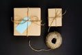 Handcrafted gift boxes wrapped in Craft paper  with blue paper card tag, and rope  for decoration Royalty Free Stock Photo