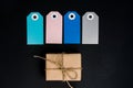 Handcrafted gift boxes wrapped in Craft paper with blue and pink paper card tag, rope for decoration Royalty Free Stock Photo
