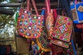 Handcrafted Indian traditional handbags displayed outside street shop. Royalty Free Stock Photo