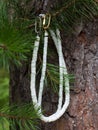 Handcrafted mother of pearl necklaces from polished pieces on natural wooden