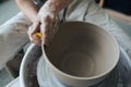 Handcrafted on a potter`s wheel,Hands make clay from various items for home and sale in the store and at the exhibition Royalty Free Stock Photo