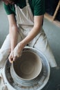 Handcrafted on a potter`s wheel,Hands make clay from various items for home and sale in the store and at the exhibition Royalty Free Stock Photo