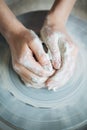 Handcrafted on a potter`s wheel,Hands make clay from various items for home and sale in the store and at the exhibition, ceramic i Royalty Free Stock Photo