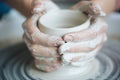 Handcrafted on a potter`s wheel,Hands make clay from various items for home and sale in the store and at the exhibition, ceramic i Royalty Free Stock Photo