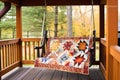 handcrafted quilt displayed on a charming porch swing