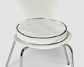 Handcrafted round white leather patchwork cushion on chair