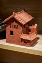 A handcrafted terracotta house model