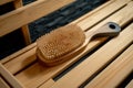 handcrafted wooden back scrubber on sauna bench