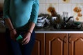 Fragment of the handcuffed female body at the kitchen counter, f